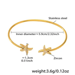 Détail d'un bracelet étoile de mer en acier inoxydable plaqué or 18k avec zircons