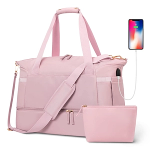 Pink waterproof fitness travel duffel bag with USB port and matching small pouch