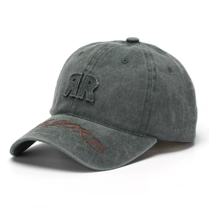Close-up of vintage washed green baseball cap with RR patch and side embroidery detail