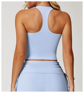 Detailed back view of a light blue racerback yoga tank top with high-stretch athletic fabric