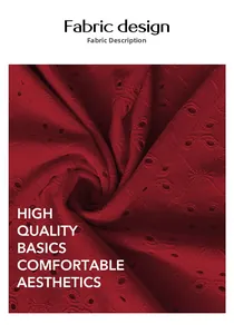 Detailed macro view of dark red hollow embroidery fabric with intricate floral patterns