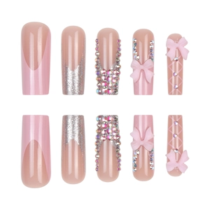 Pink French press-on nails with 3D bows and rhinestones in a 10-piece set display