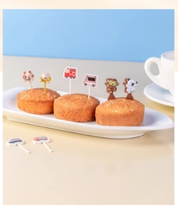 Detail of cute animal and vehicle fruit picks on cupcakes for creative bento decoration