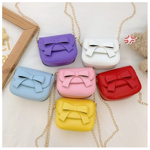 Variety of colorful mini crossbody bags with bow knots and metal chain straps for girls