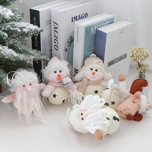 Detail of plush reindeer and Santa figures with metal bells for Christmas tree decor