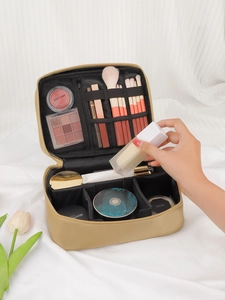 Detail view of large capacity makeup bag with brush slots and adjustable dividers
