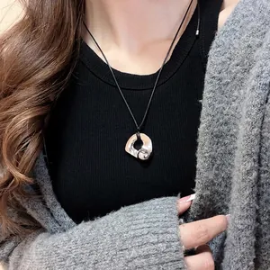 Liquid metal style necklace with irregular silver double heart pendant on black cord