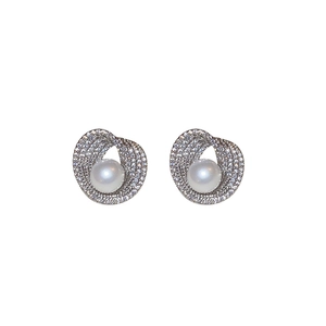 Elegant silver stud earrings with round white pearl and zircon spiral layers on white background