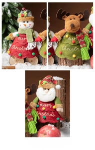 Close-up of plush Christmas ornaments featuring Santa, Snowman and Reindeer with embroidery