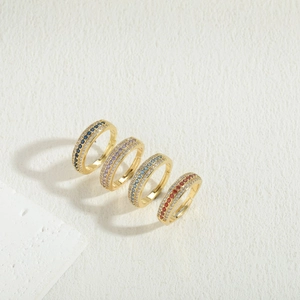 Detail of 14K gold plated zircon rings featuring blue, purple and red stones in micro-pave setting
