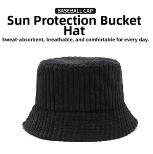 Detailed texture of black corduroy bucket hat showing vertical ribbed fabric stripes