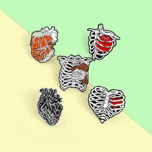 Five-piece anatomical heart and rib cage enamel pins set for Halloween costumes