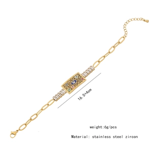 Detail of gold evil eye bracelet showing white zircon inlay and dimension specifications