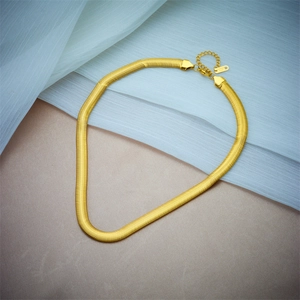 Detailed flat snake chain necklace in gold finish with elegant lobster clasp