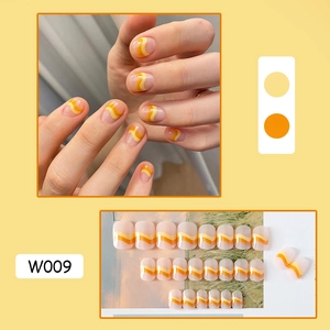 Detail view of W009 press-on nails featuring yellow and orange wave pattern design