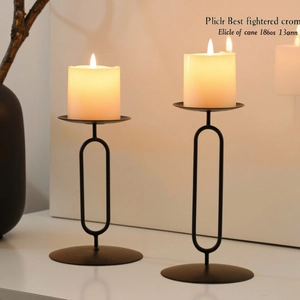 Nordic minimalist black metal candlestick set with geometric oval frames and matte finish