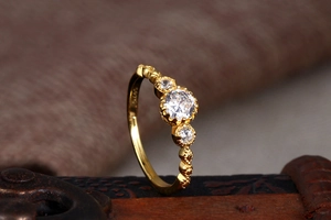 Macro shot of S925 sterling silver ring featuring golden finish and engraved hallmark