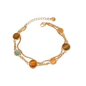 Double-layer 18k gold-plated bracelet with vintage round cat-eye stones on white background