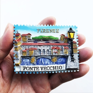Detailed hand-held view of a 3D resin Florence Ponte Vecchio stamp fridge magnet souvenir