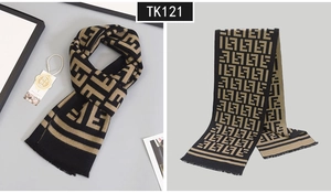 Detail view of plaid wool scarf featuring luxury jacquard pattern and fringe edges
