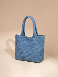 Handwoven blue denim texture tote bag with matching handles and a casual minimalist style