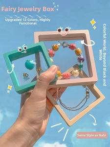 Detail of PE film suspension jewelry display boxes in mint, pink, and beige colors