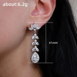 Silver long drop tassel earrings with pear-shaped zircon stones, 41mm length shown on model