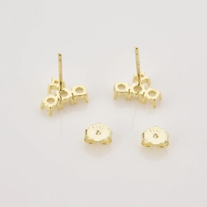 Detail shot of the S925 sterling silver hallmark on the gold-plated stud earring