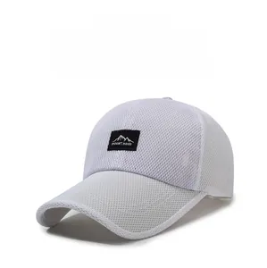Close-up of white breathable mesh fabric on baseball cap with Mount Hood label