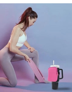 Pink neoprene storage pouch with zipper attached to water bottle with elastic band