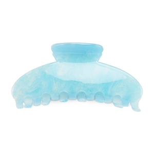 Close-up of light blue acrylic shark hair claw clip with star-like glitter particles