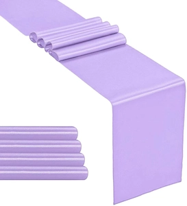 Close-up of purple satin table runner with high gloss texture for wedding decoration