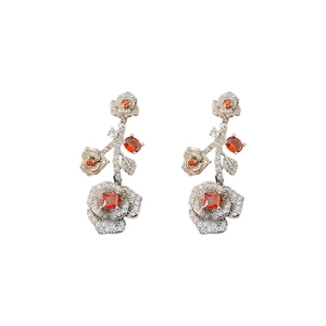 Vintage silver flower drop earrings with sparkling crystals and orange gemstones