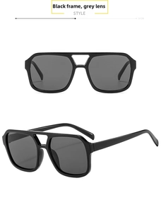 Detail view of square black retro sunglasses with gray lenses and double bridge design