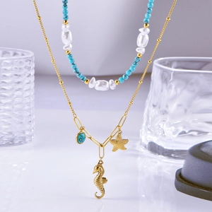 Double-layer turquoise and pearl necklace with starfish and seahorse ocean pendants