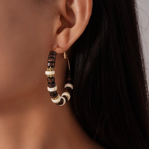 Bohemian retro wood bead hoop earrings with geometric round design on model