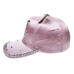 Detailed view of pink satin baseball cap with sequined cat whiskers and cat ears