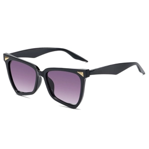 Chic oversized cat-eye sunglasses with purple gradient lenses and gold triangle detail