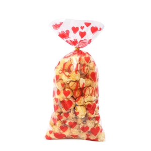 Transparent Valentine candy bags with red hearts and Love You print for popcorn