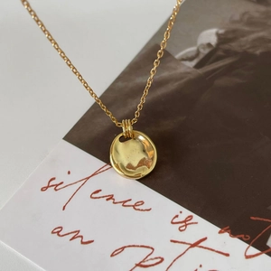 Minimalist 925 sterling silver necklace with a gold circular irregular pendant design