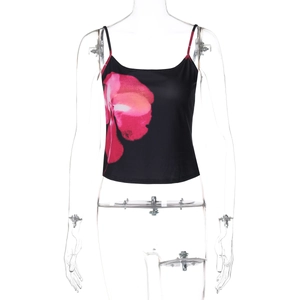 Detail of black camisole featuring large pink floral print and slim spaghetti straps