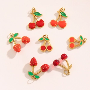 Detailed view of 18K gold plated cherry and strawberry enamel fruit pendants for DIY jewelry