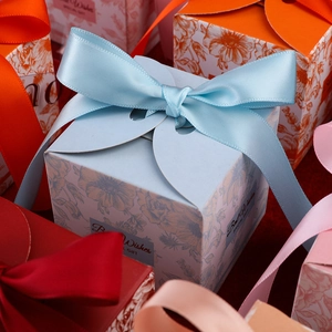Floral watercolor wedding candy boxes with ribbons and gold-stamped Best Wishes text