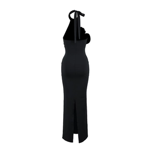 Back view of black halter neck dress with cutout back and 3D floral accent detail