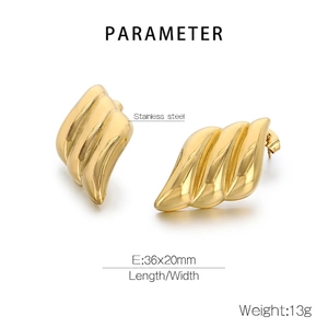 Macro detail of 18K gold-plated wing earrings showing 36x20mm dimensions and 13g weight