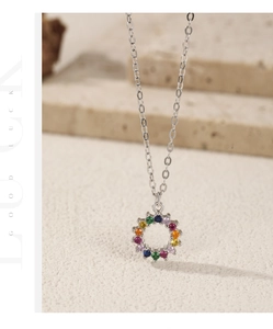 Macro shot of S925 sterling silver necklace with rainbow colored cubic zirconia stones