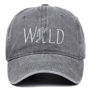 Detailed close-up of WILD embroidery with Bigfoot silhouette on washed grey cotton cap