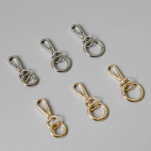 Polished gold and silver metal snap hooks with round rings for bag accessories