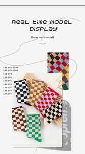 Detail of checkered crew socks in various colors including black, white, and yellow