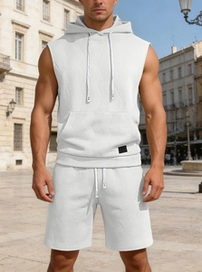 Close-up of white hooded sleeveless tank top and shorts set with waffle knit texture